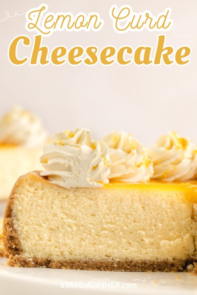 A slice of lemon curd cheesecake topped with whipped cream and lemon zest, with more cheesecake in the background.
