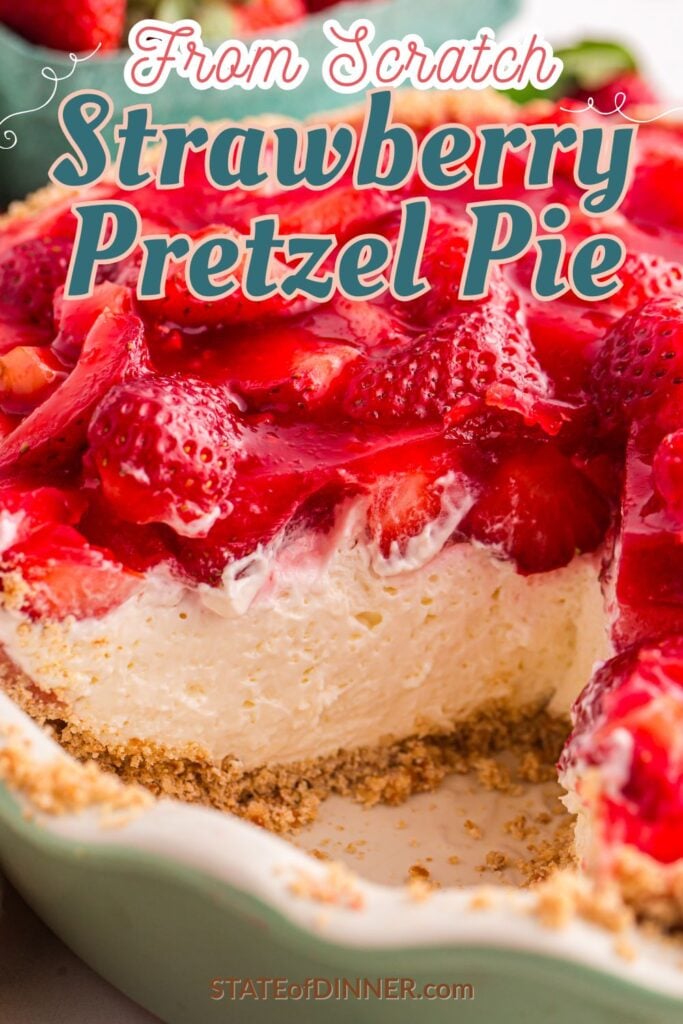 Close-up of a strawberry pretzel pie with a slice missing, showing creamy filling and fresh strawberry topping.