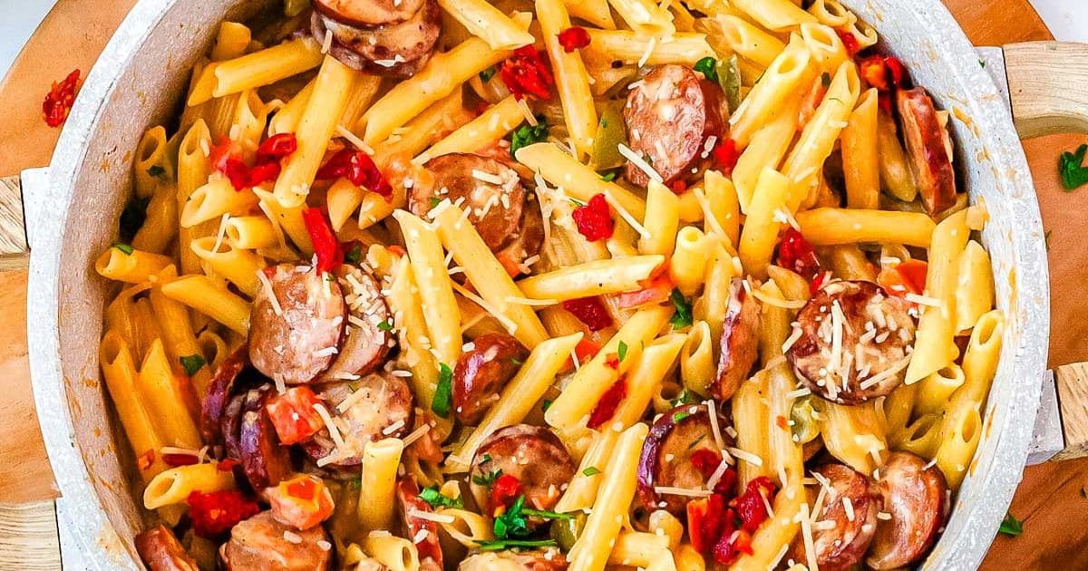 Penne pasta with sausage, sun-dried tomatoes, and cheese in a creamy sauce.