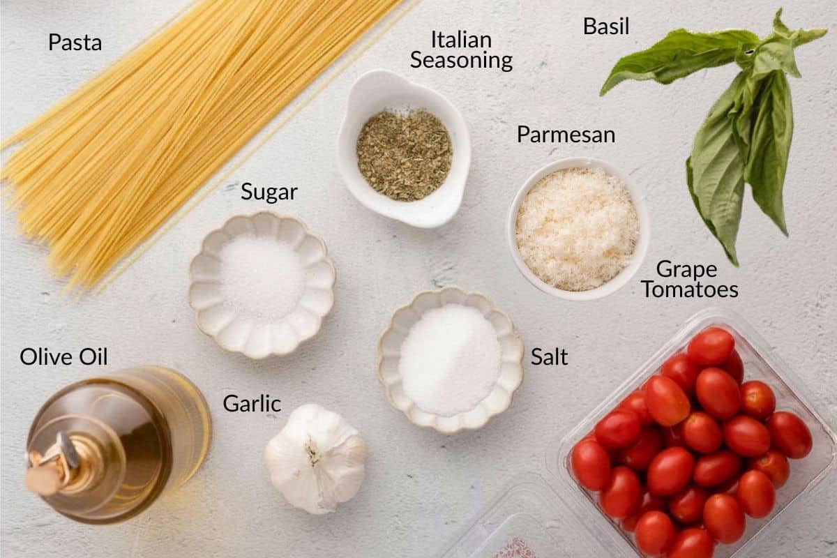 Ingredients for pasta: dry spaghetti, basil, parmesan, grape tomatoes, garlic, olive oil, sugar, salt, Italian seasoning.