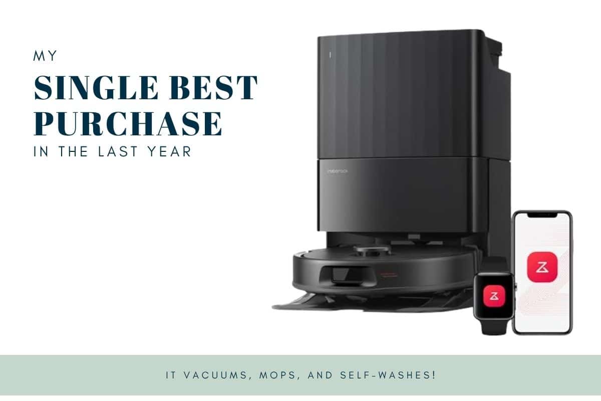 A black robot vacuum with a dock, smartphone, and smartwatch, labeled as a top purchase of the year.