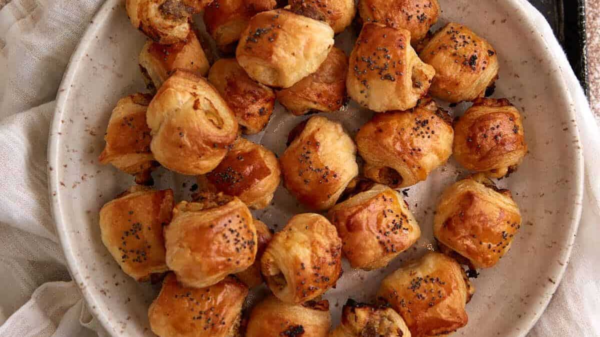 A close up shot of apple sausage rolls.