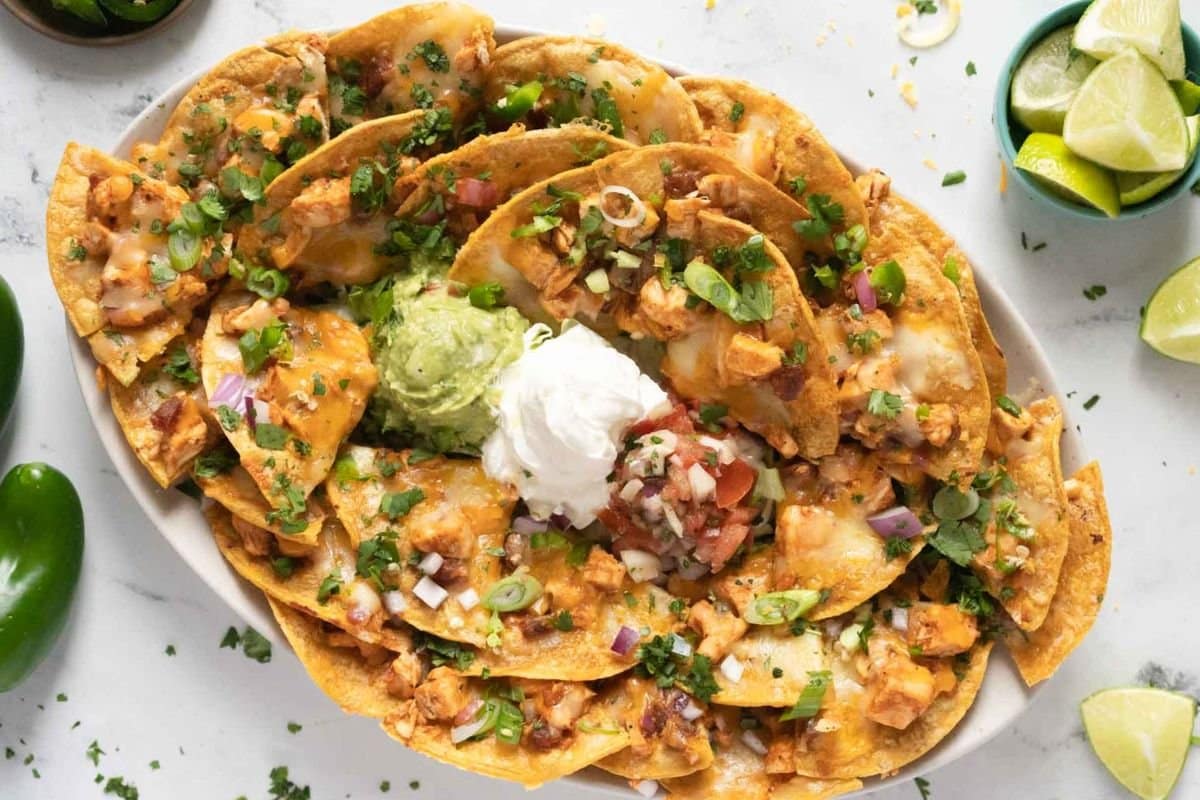 A close up shot of bbq chicken nachos.