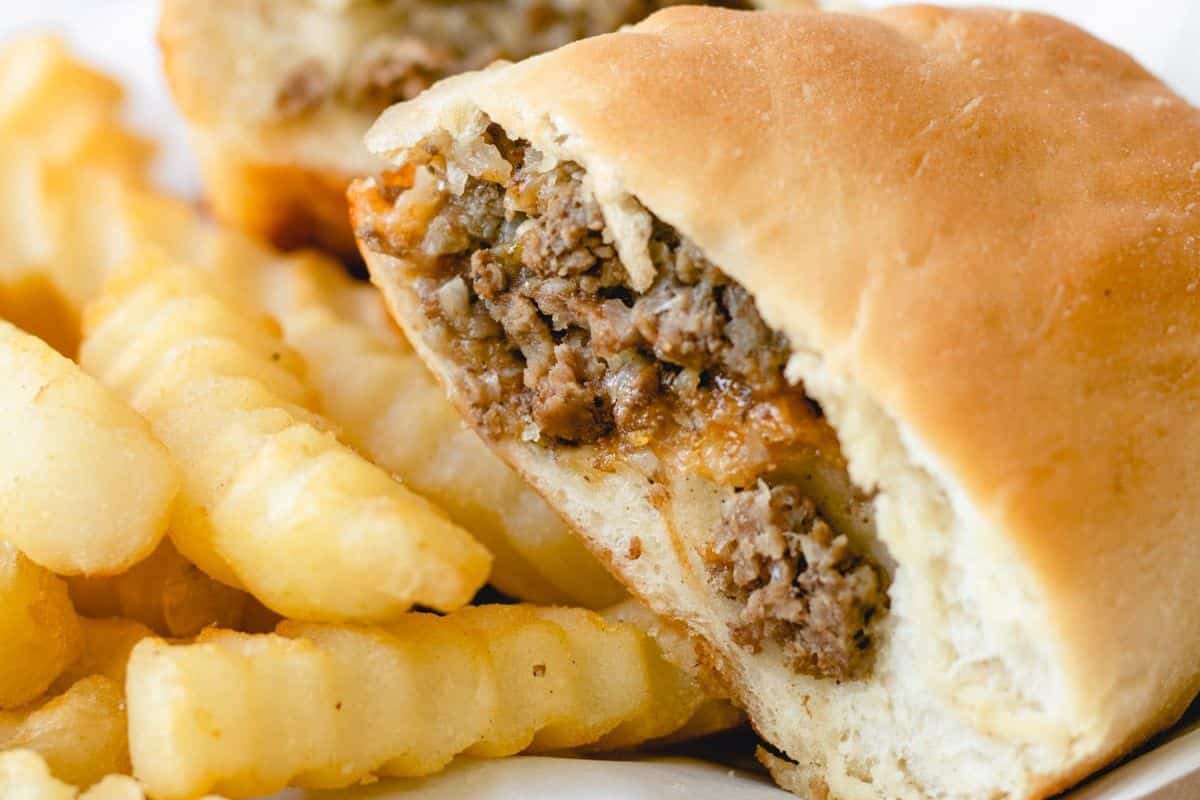 A meat-filled bread pocket served with crinkle-cut fries.