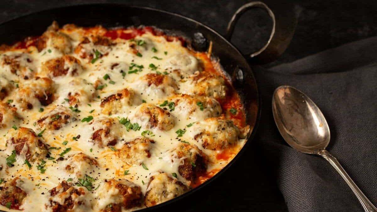 A close up shot of chicken parmesan meatballs.