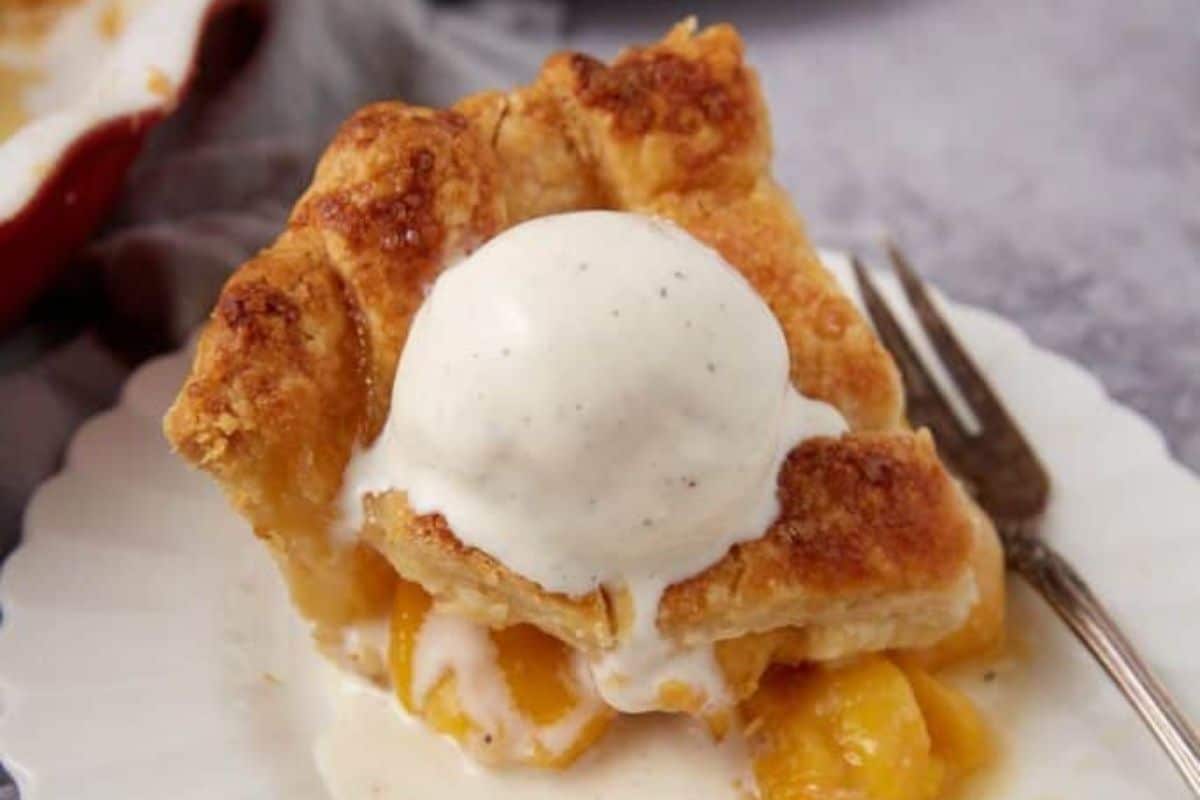 A close up shot of peach pie.