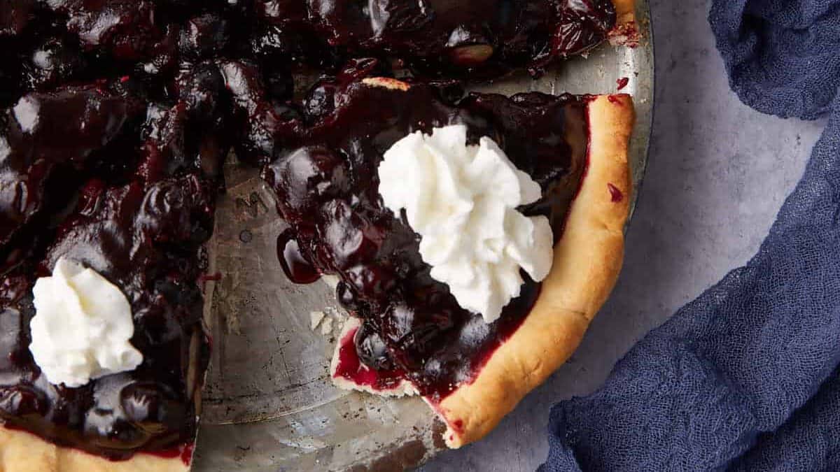 A close up shot of blueberry pie.