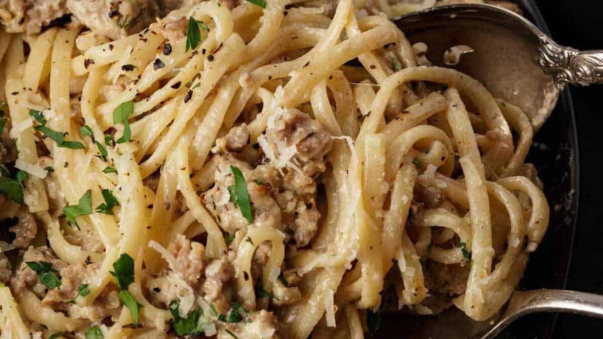 A close up shot of sausage pasta.