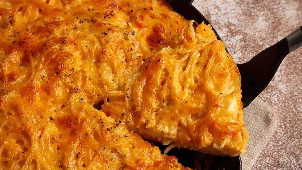 A close up shot of spaghetti pie.
