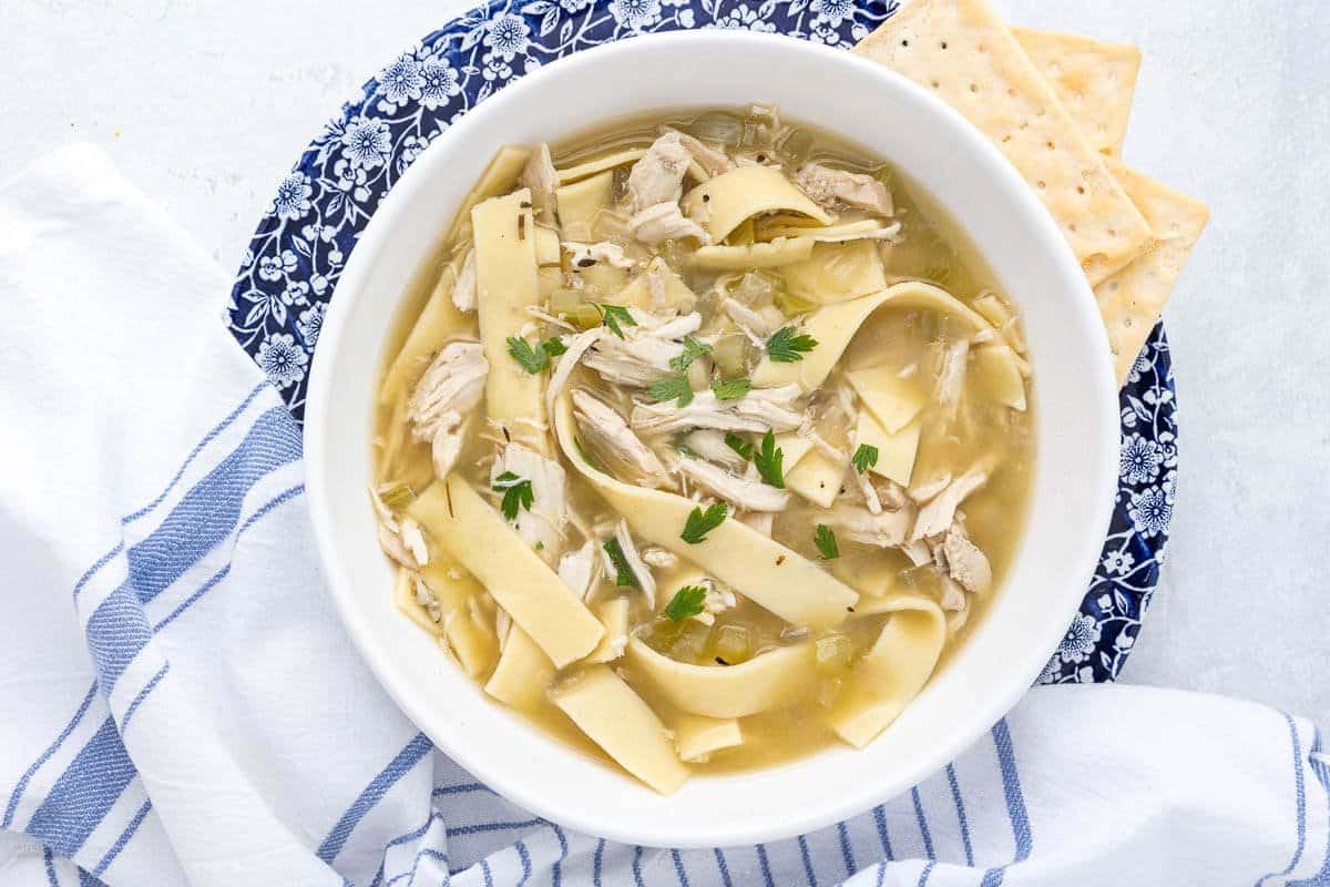 A close up shot of chicken noodles soup.