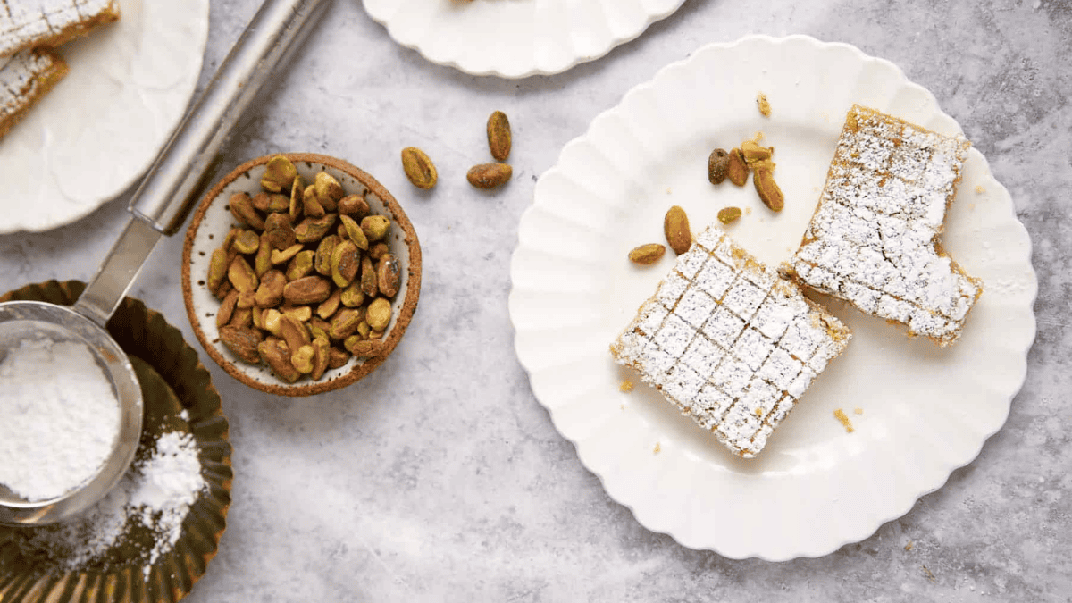 A close up shot of pistachio lemon bars.