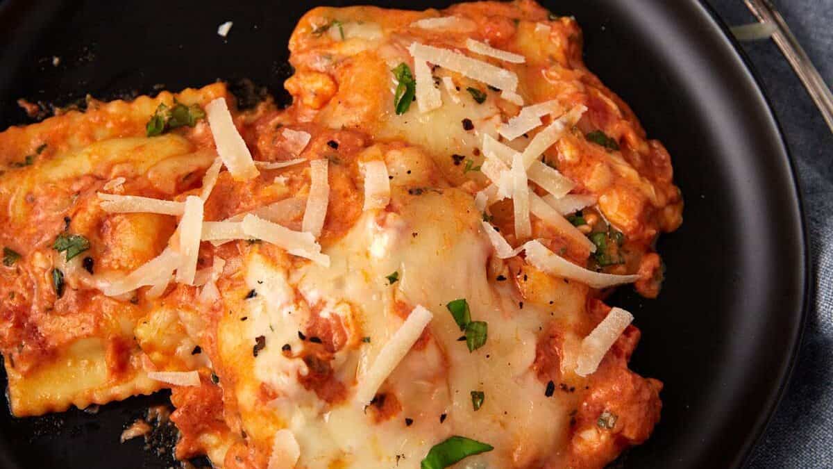 A close up shot of baked ravioli.