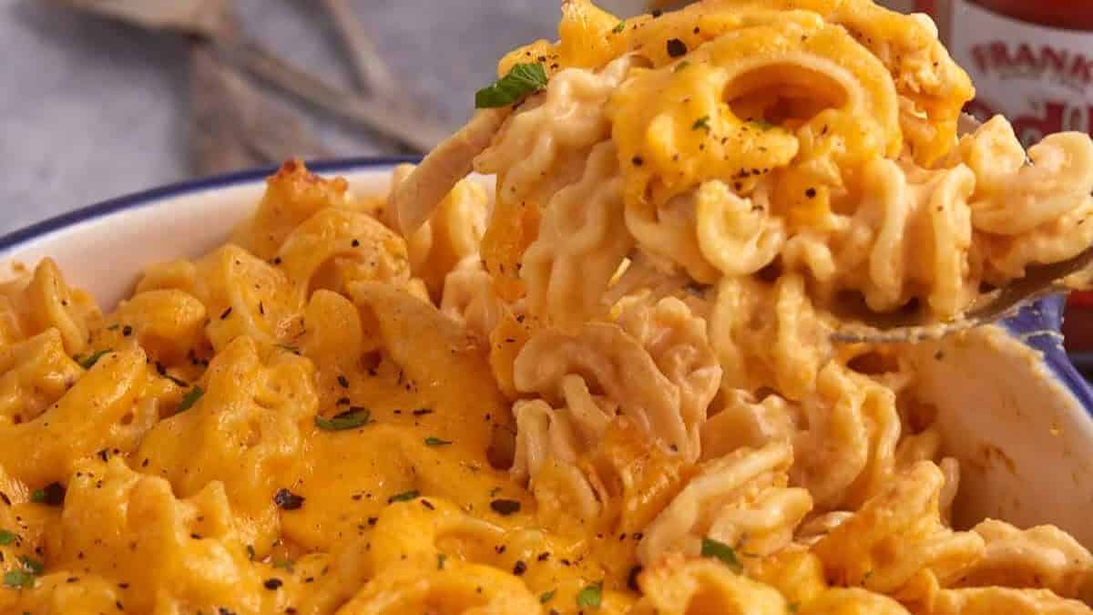 A close up shot of baked buffalo chicken mac and cheese.