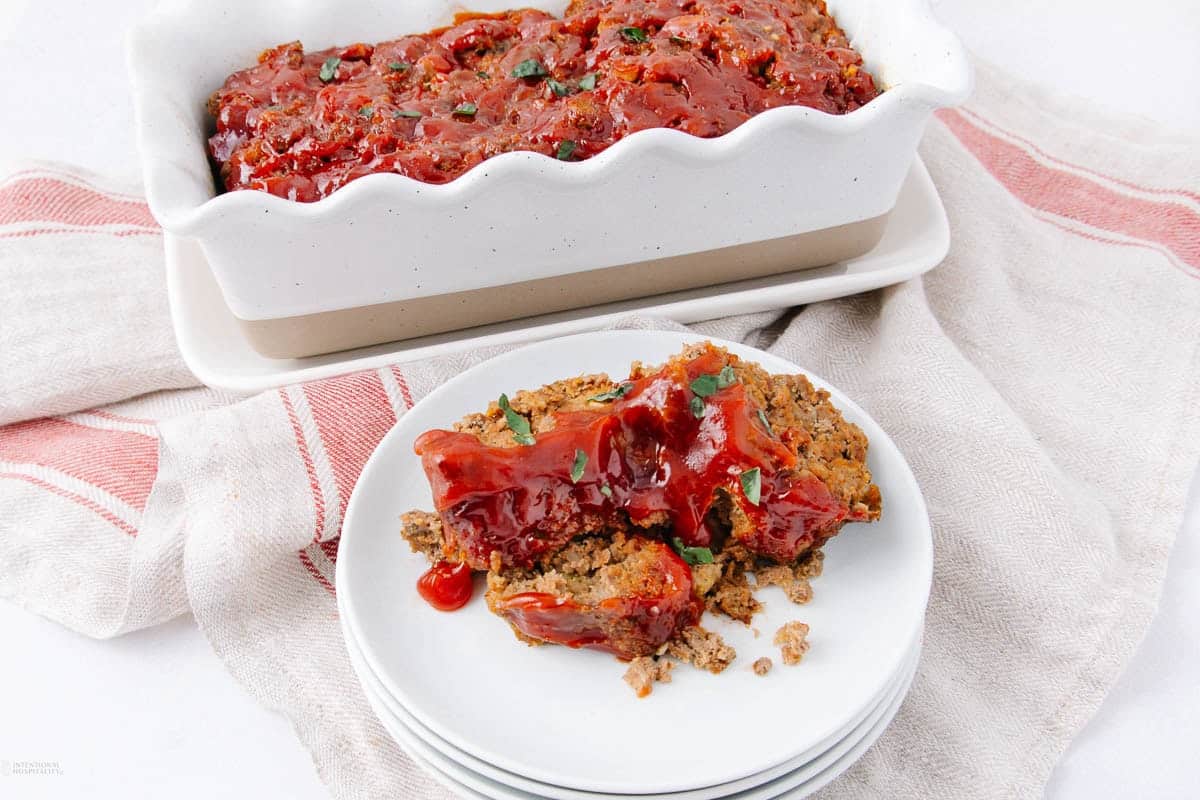 A close up shot of meatloaf on a plate.