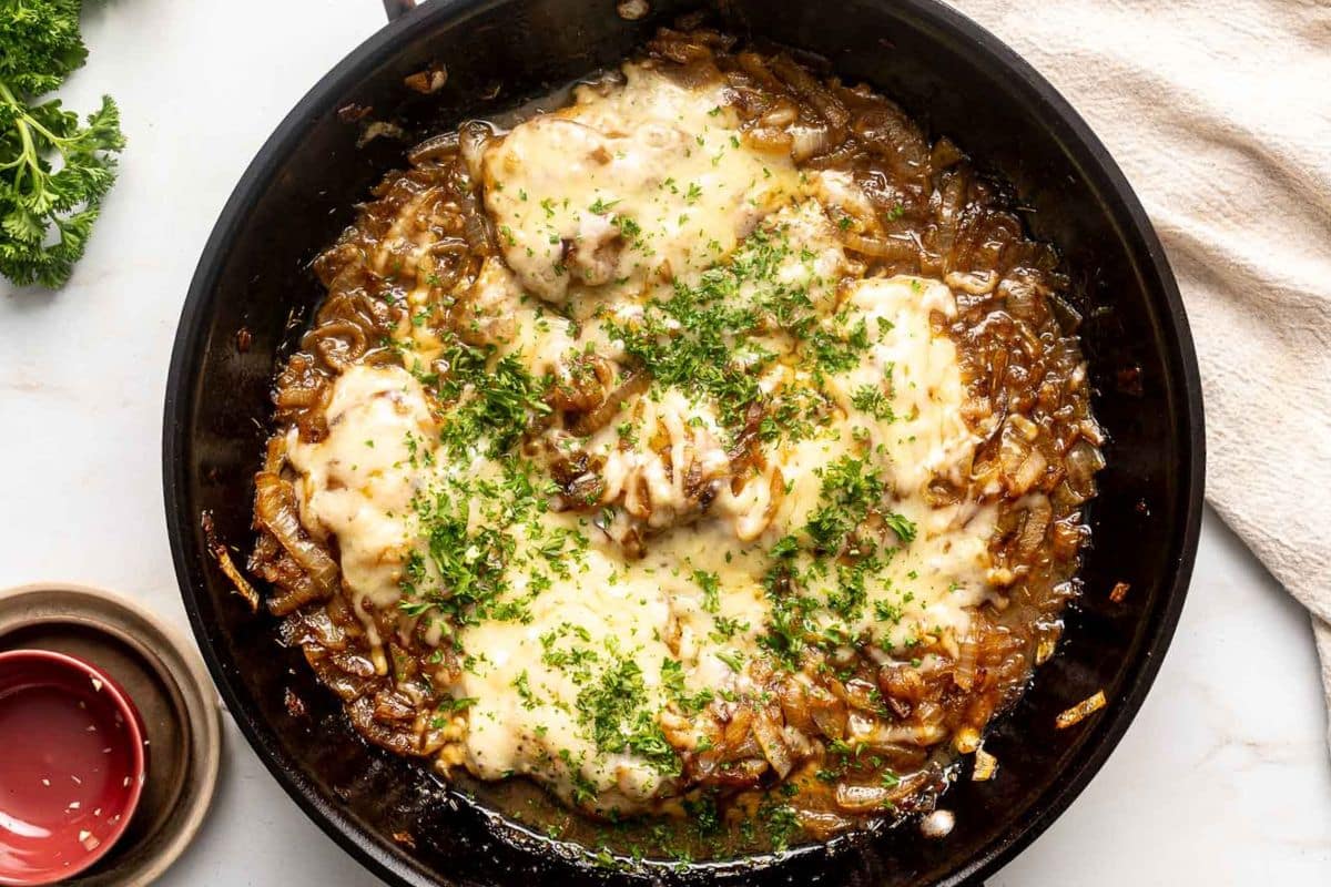 A close up shot of French Onion Chicken Bake with Gruyere.