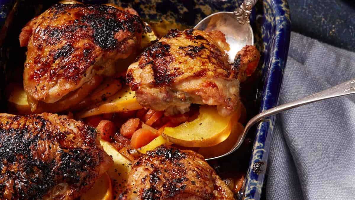 A close up shot of chicken and acorn squash dinner.