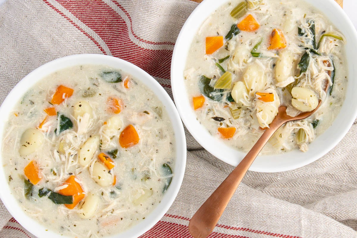 A close up shot of chicken gnocchi soup.