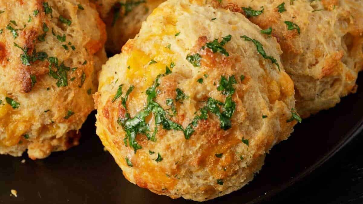 Cheddar cheese biscuits topped with chopped parsley.