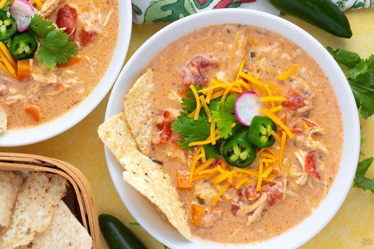 A close up shot of Cheesy Tortilla Mexican Chicken Soup.