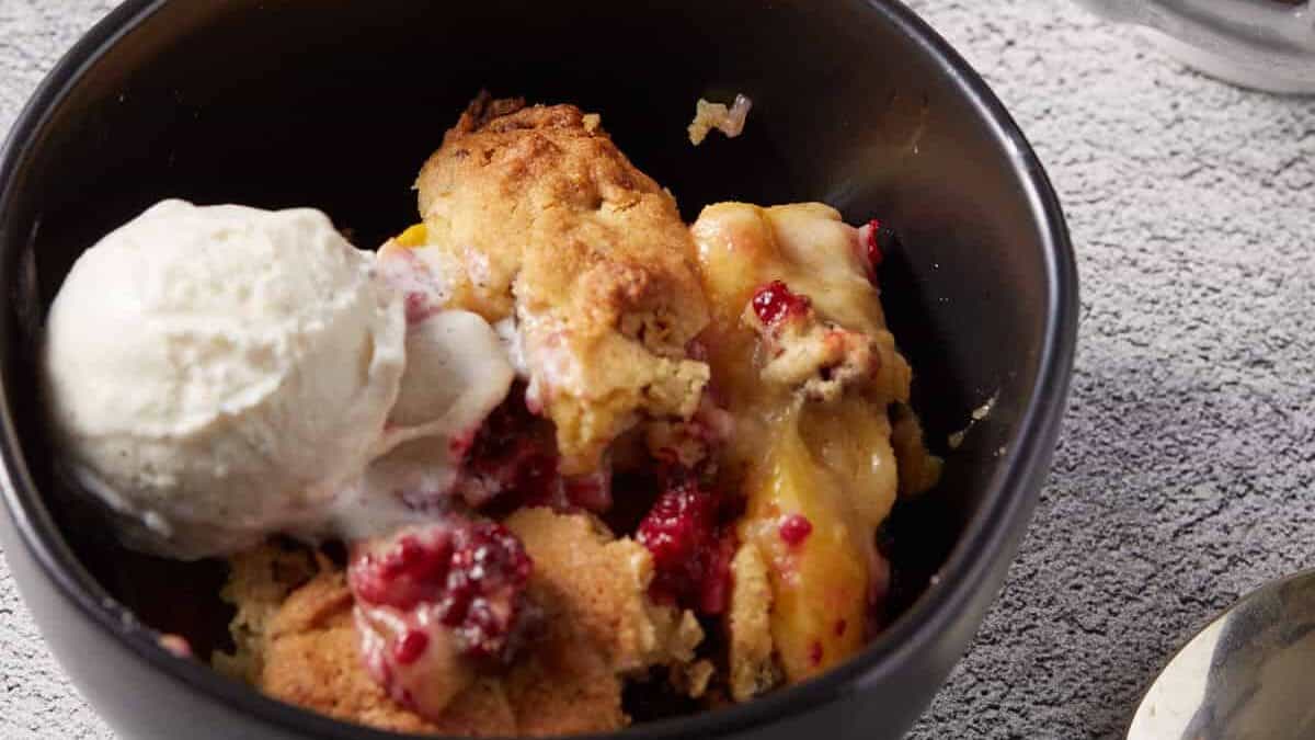 A close up shot of Blackberry Cobbler with Peaches.