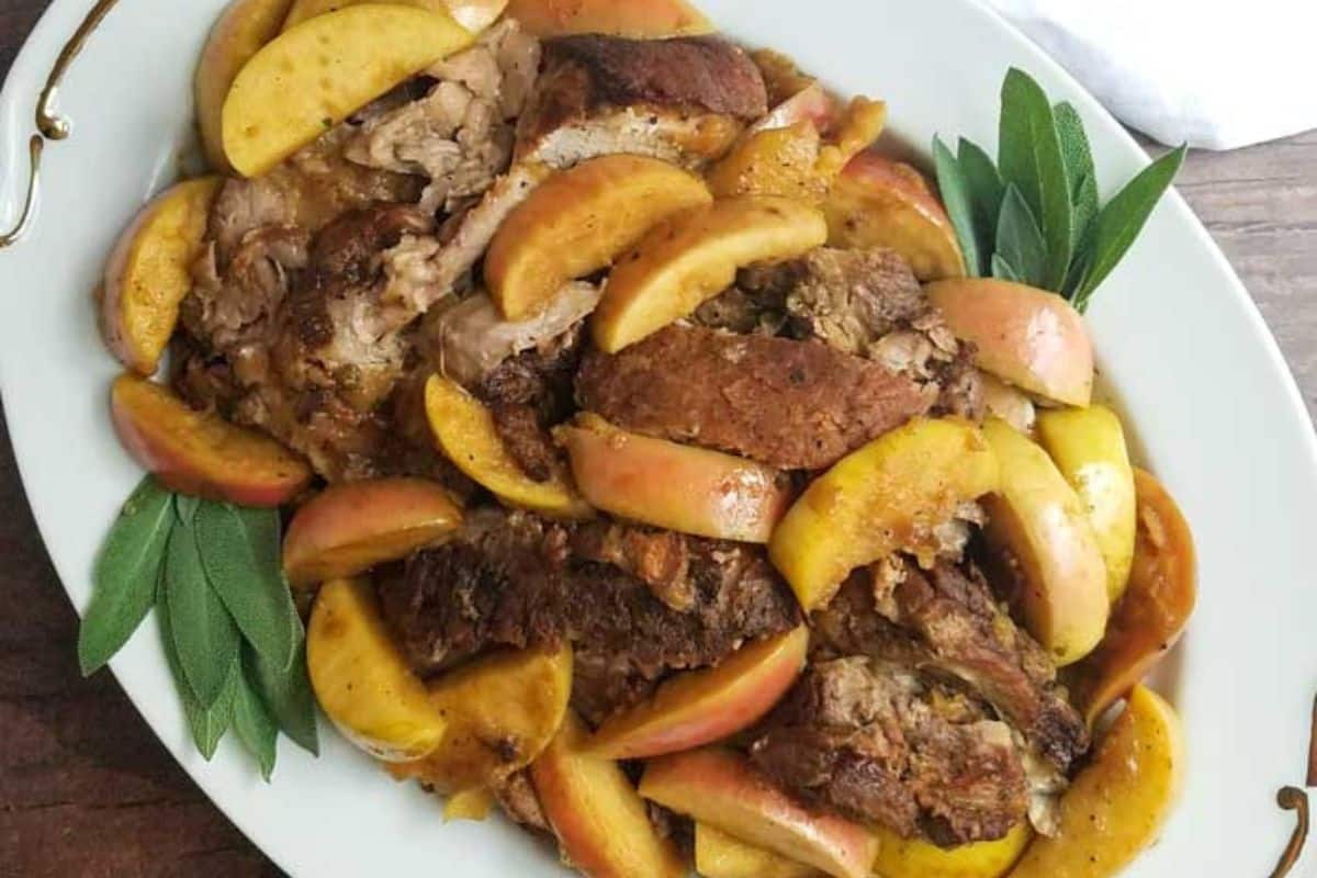 A close up shot of Cider Braised Pork Shoulder with Apples.