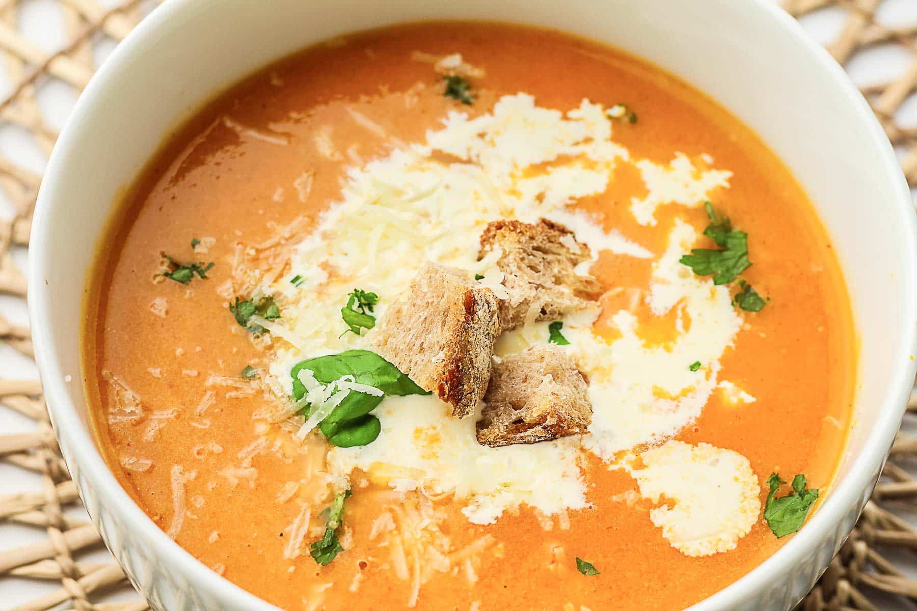 A close up shot of tomato soup.