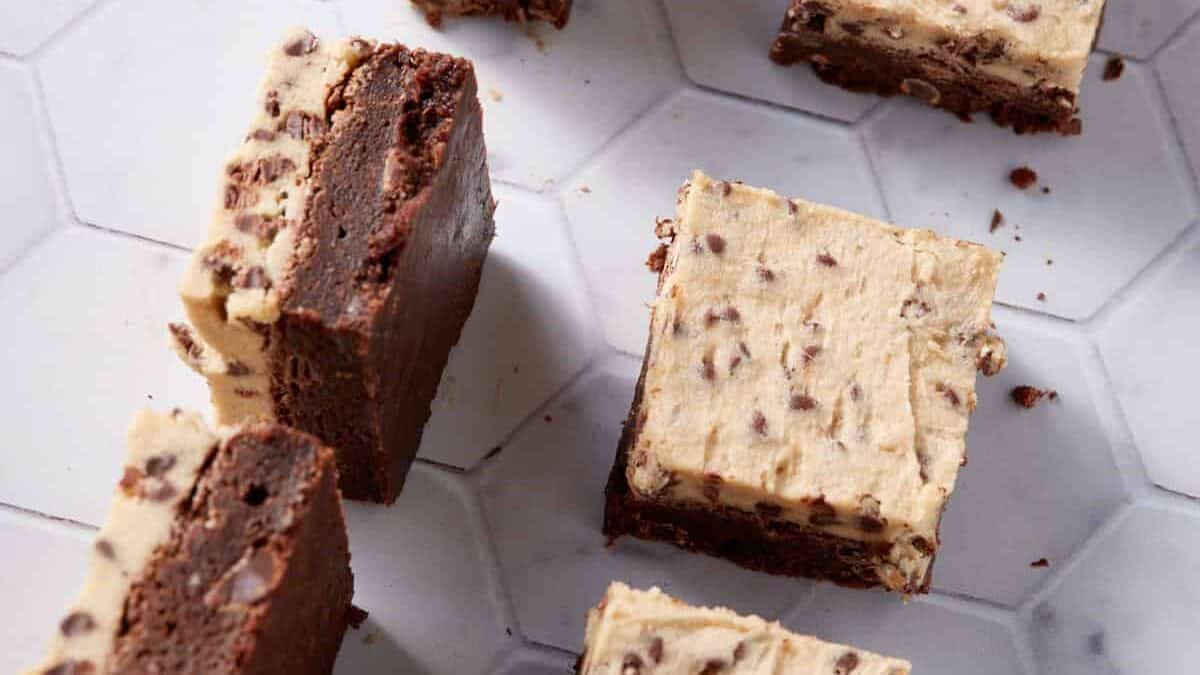 A close up shot of brownies with edible cookie dough frosting.