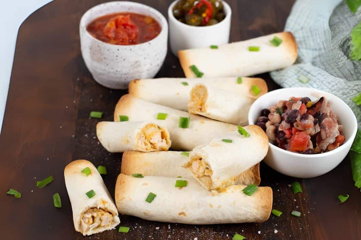 A close up shot of chicken taquitos.