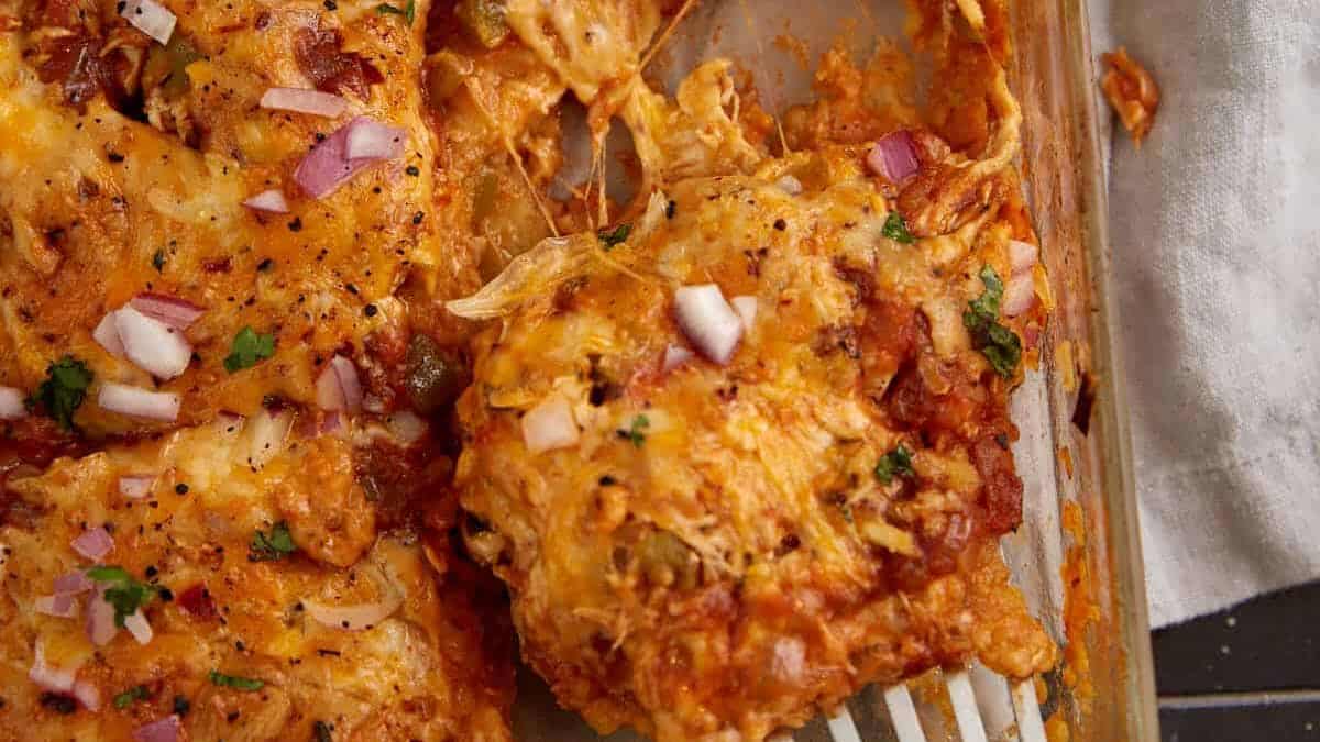 A close up shot of chicken enchilada layered casserole.