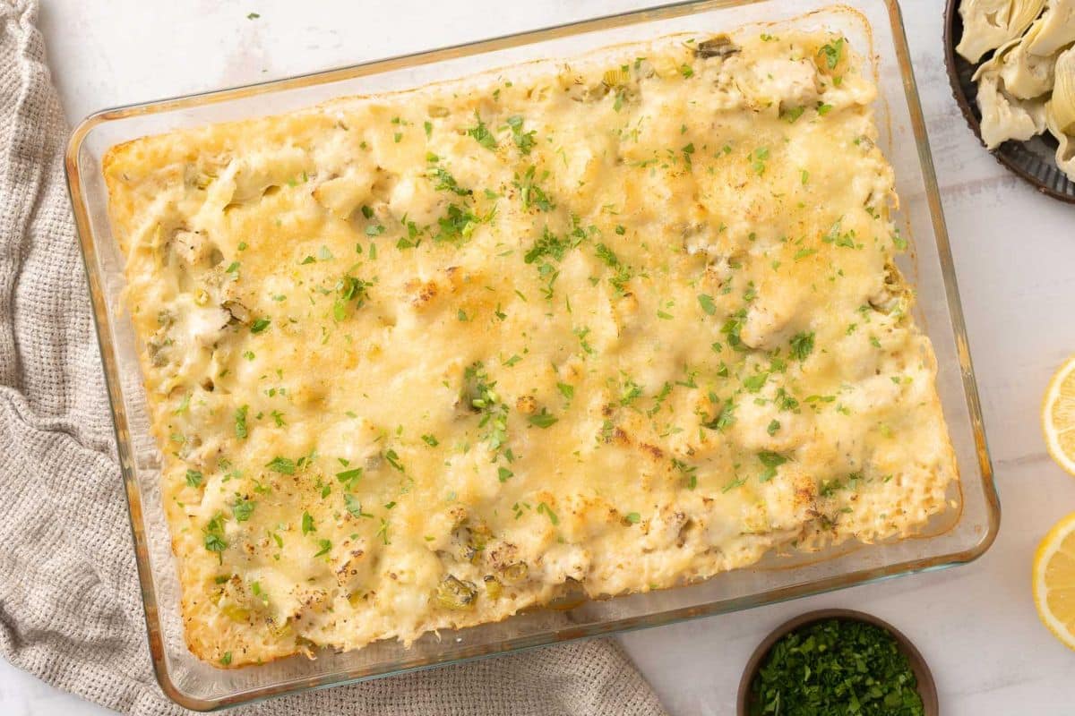A close up shot of chicken artichoke casserole.