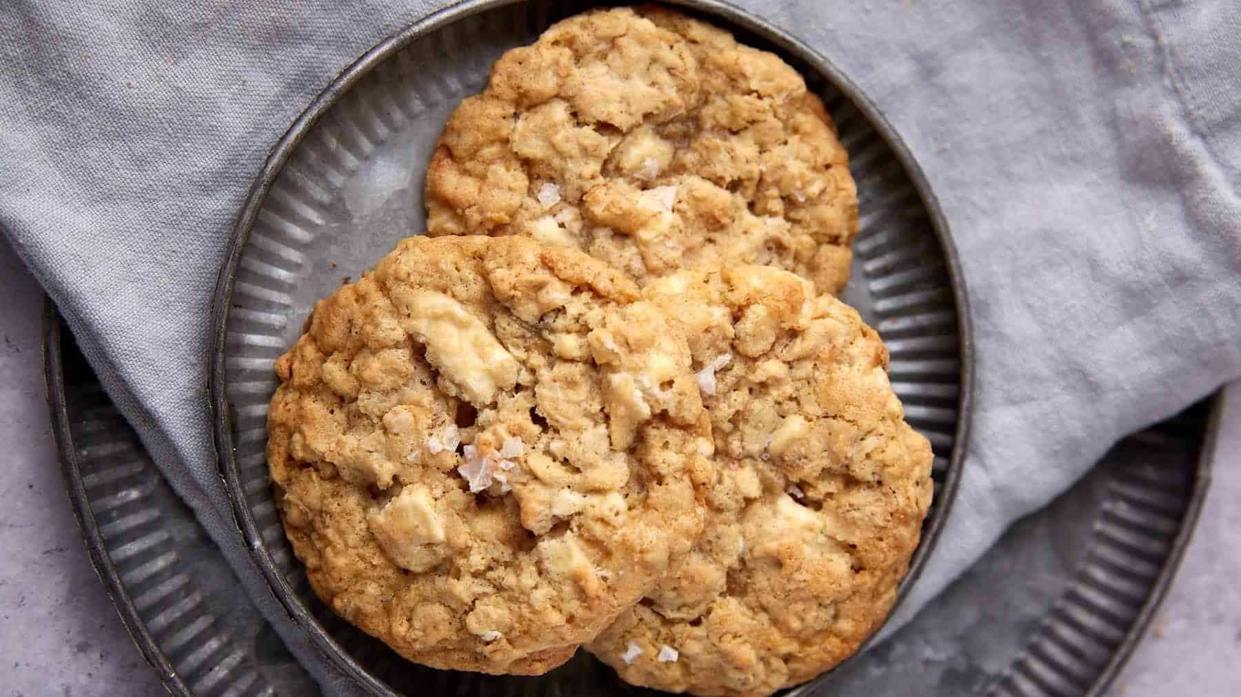 A close up shot of white chocolate oatmeal cookies.