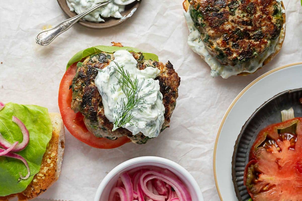 A close up shot of spinach and feta turkey burgers.