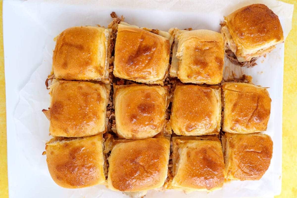 A close up shot of BBQ pulled pork sliders.