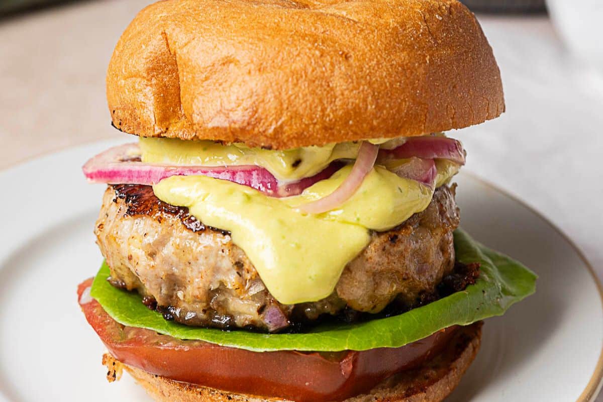 A close up shot of turkey burgers.